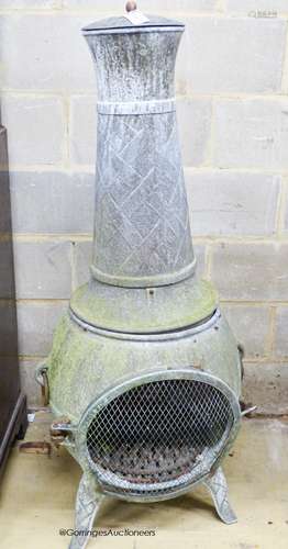 A weathered metal garden chiminea, height 140cm