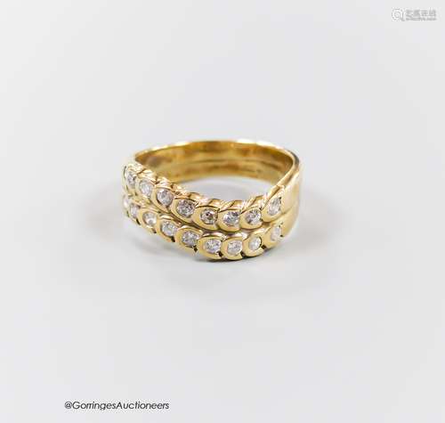 A modern 9ct gold and two row diamond set half hoop ring, si...