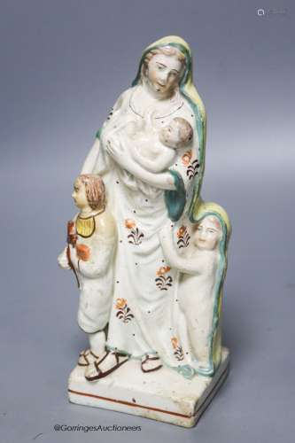A Staffordshire pearlware group of a mother and children, c....