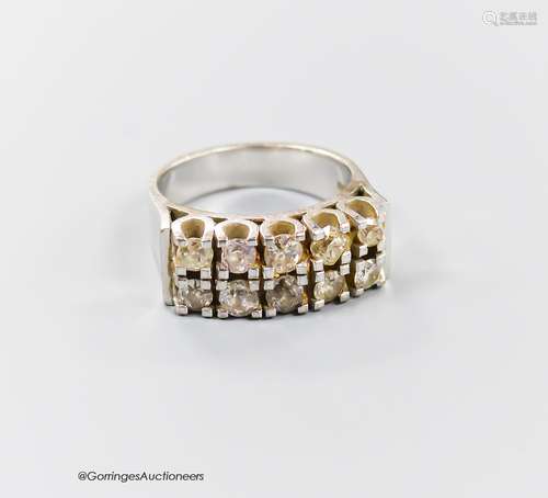 A modern 18ct white metal and ten stone diamond set two row ...