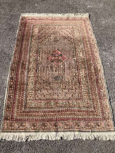 A North West Persian red ground rug, decorated with Saz leaf...