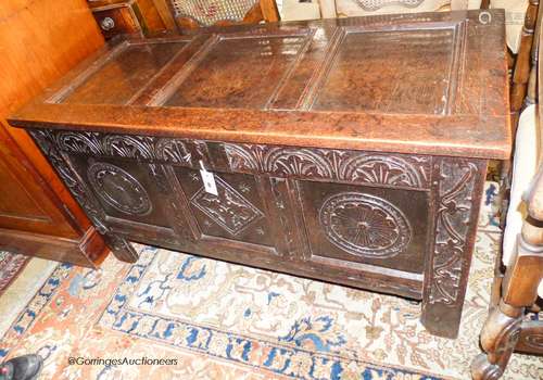 A late 17th century carved and panelled oak coffer, length 1...