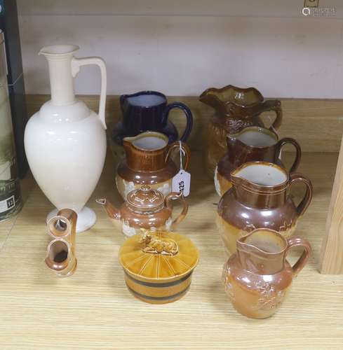 A group of Doulton stoneware: jugs, a teapot, butter dish an...