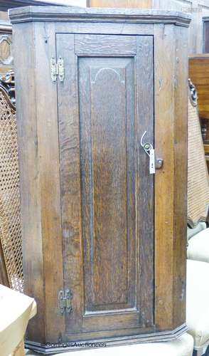 An 18th century and later oak corner cupboard, width 53cm, d...