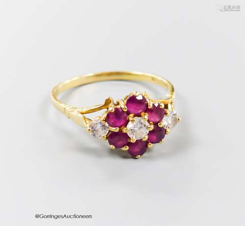 A modern 18ct gold, ruby and diamond set cluster ring, size ...