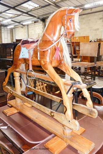 An Edwardian Lines Bros. pine rocking horse, length 144cm, h...