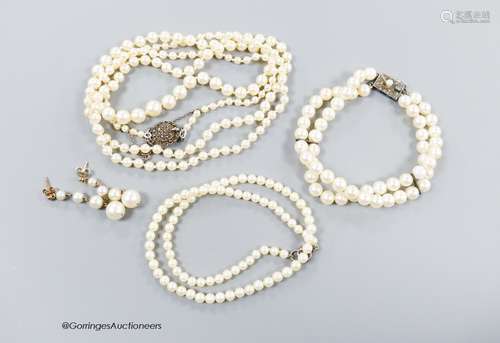 A long single strand graduated cultured pearl necklace, with...