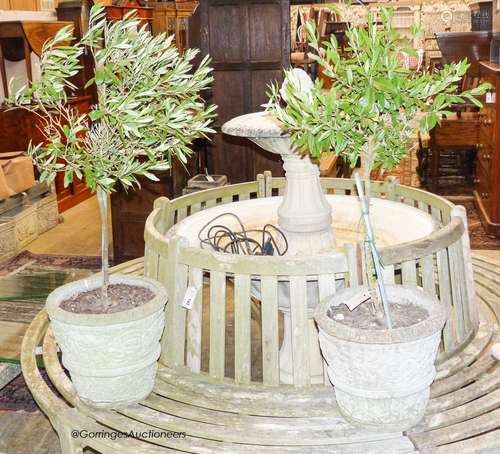 A pair of reconstituted stone tapered cylindrical planters, ...