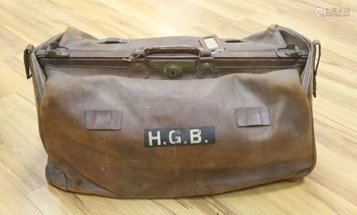 A large Gladstone bag, military canvas contents