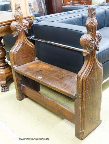 A pair of 15th century oak pew ends with stylised leaf and b...