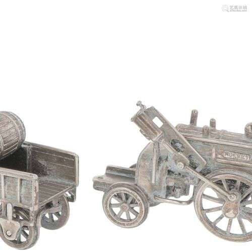 Miniature steam train with trailer silver.