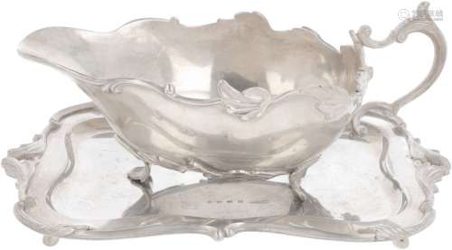 Sauce boat with silver dish.