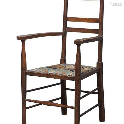 Un fauteuil en chêne de style Arts and Crafts, c.1905, Le do...