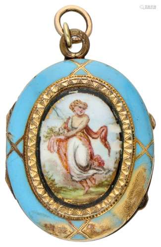 14K. Yellow gold medallion pendant with blue enamel.