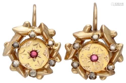18K. Yellow gold antique earrings set with garnet and rhines...
