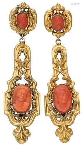 18K. Yellow gold antique earrings set with four red coral ca...