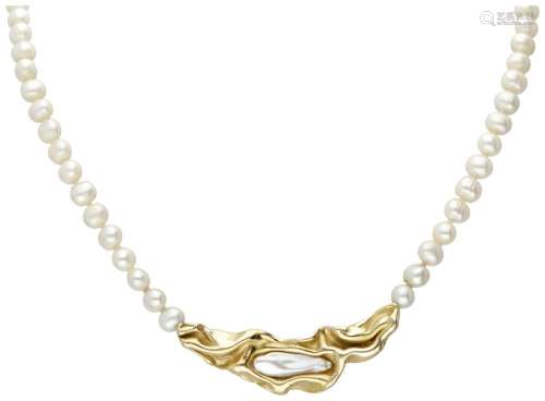 Single strand pearl necklace with an 18K. yellow gold closur...