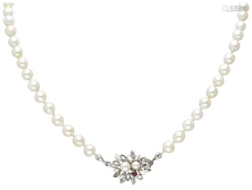 Single strand pearl necklace with a 14K. white gold closure ...