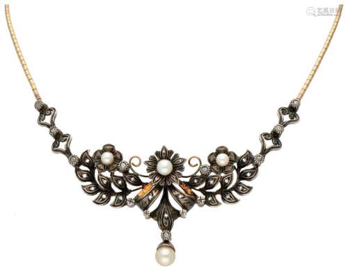 18K. Yellow gold Portuguese necklace with a floral designed ...
