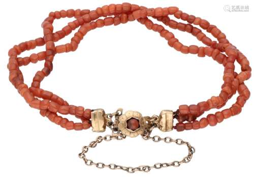 Three-row antique red coral bracelet with a 14K. yellow gold...