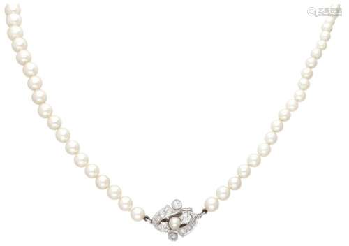 Freshwater pearl necklace with a 14K. white gold closure set...