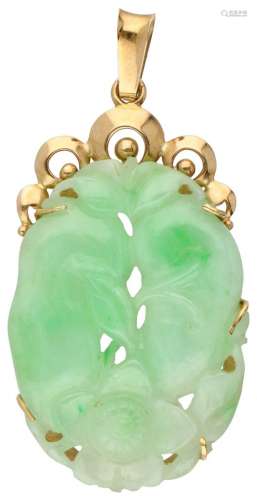 Pendant with carved jade in a 14K. yellow gold frame.