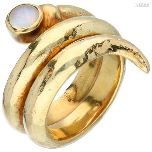 18K. Yellow gold hammered snake-shaped ring set with a tripl...