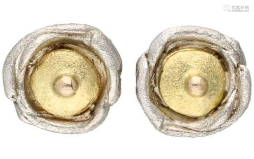 Silver matted design ear studs with an 18K. yellow gold cent...