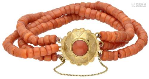 Three-row red coral vintage bracelet with a 14K. yellow gold...