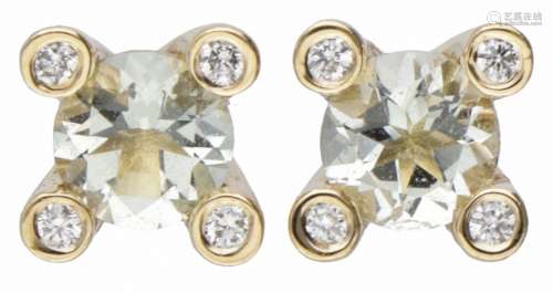 18K. Yellow gold Bron earrings set with approx. 0.72 ct. aqu...