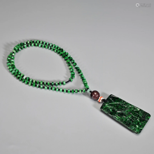A Carved Jadeite Pendant Qing Dynasty