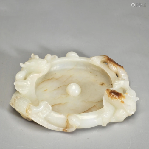 A Carved White and Russet Jade Washer Qing Dynasty