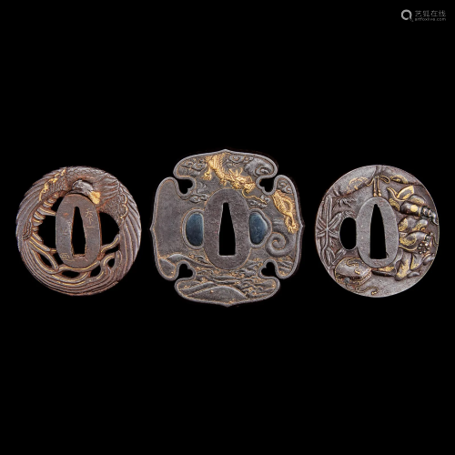 A group of three Japanese gold-inlaid iron tsuba, one