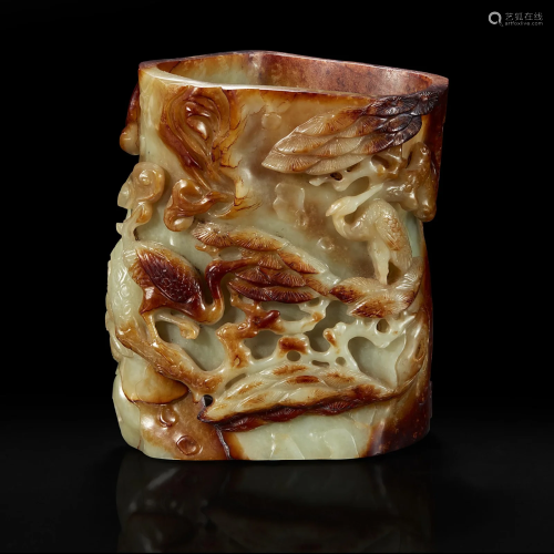 A Chinese carved russet and celadon jade brush holder