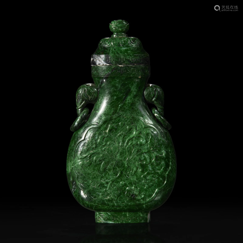 A Chinese carved chloromelanite vase and cover 玉