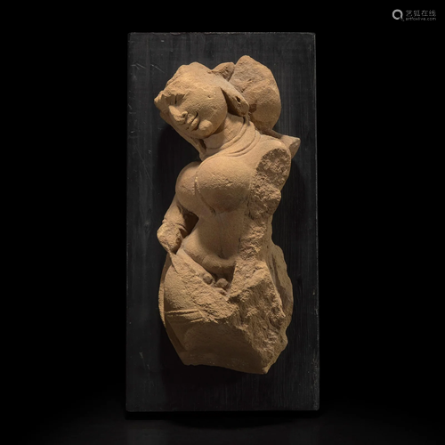 An Indian carved buff sandstone figure of an Apsara