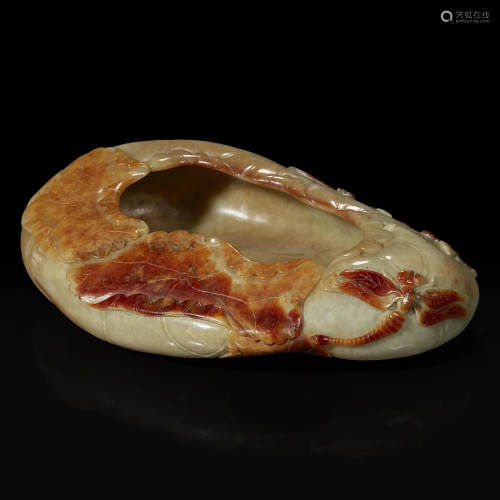 A Chinese carved russet and beige jade 