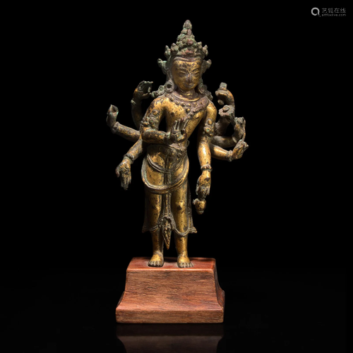 A Nepalese gilt copper alloy figure of Amoghapasha