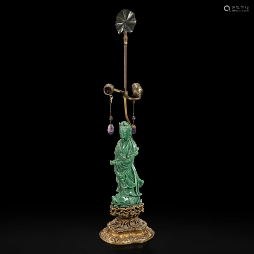 A Chinese carved green aventurine quartz Guanyin,