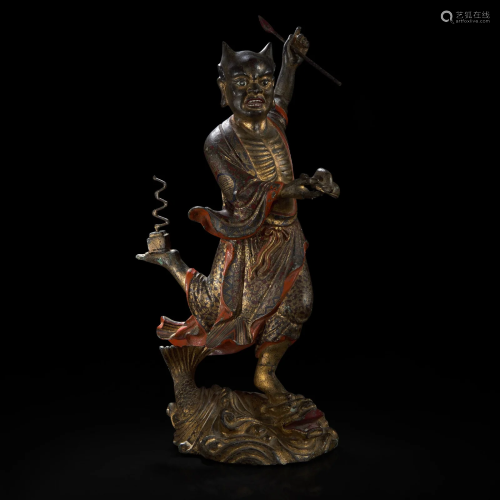 A large Chinese gilt and lacquered bronze figure of