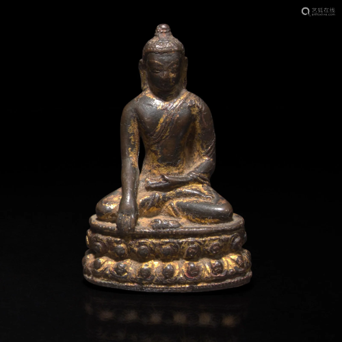 A small Indian or Himalayan gilt copper alloy figure of