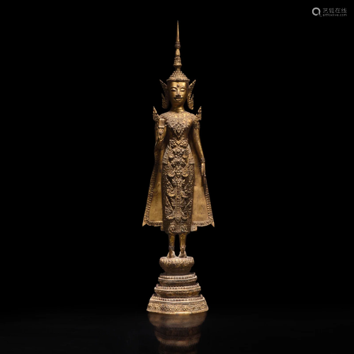 A Thai gilt lacquered bronze standing Buddha 泰