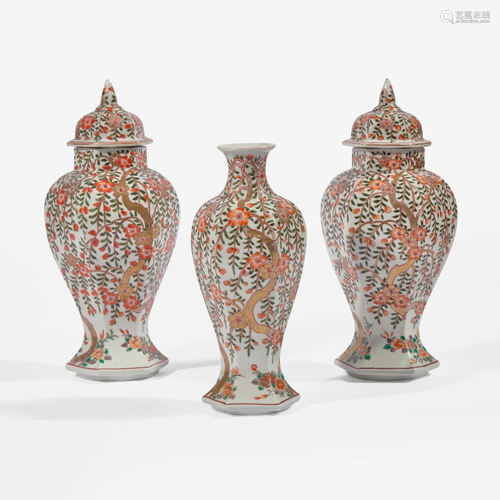 A garniture of three Japanese baluster jars and a vase