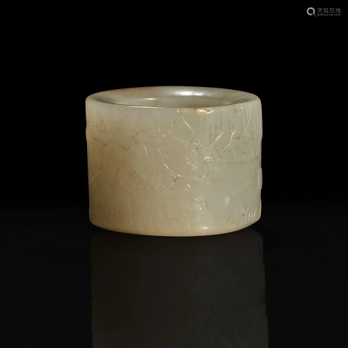 A large pale celadon and russet jade archer ring with