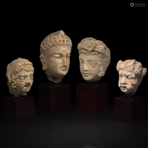 A group of four small stucco heads 石灰