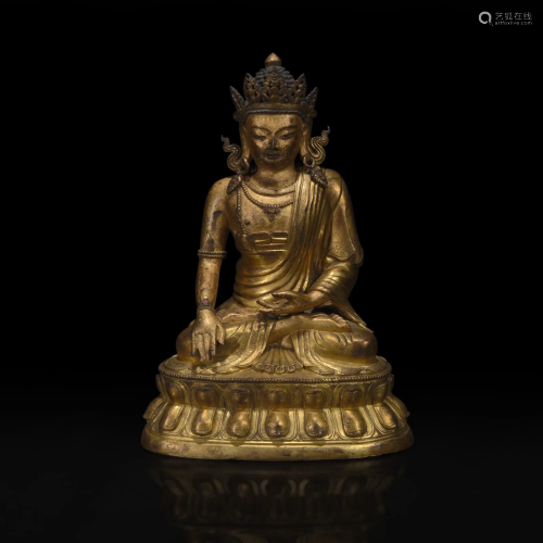 A Sino-Tibetan gilt bronze figure of Akshobhya 中