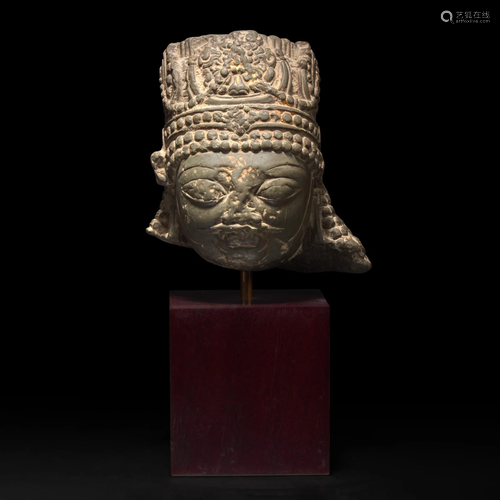 A Kashmiri carved stone head of a crowned figure