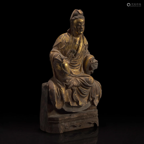 A Chinese gilt-lacquered stucco figurine of Guanyin
