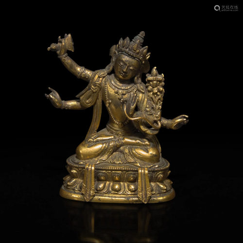 A small Sino-Tibetan gilt bronze figure of Manjusri