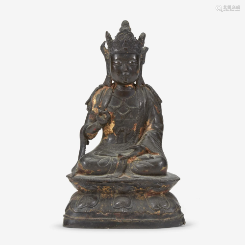 A Chinese lacquered bronze figure of Guanyin 铜